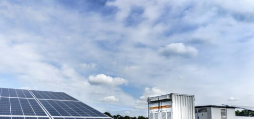 white and black solar panels under white clouds and blue sky during daytime